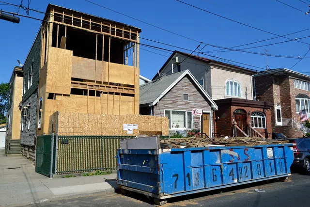 house, under construction, construction, men at work, dumpster, garbage, trash, demolition, trash removal, property, housing, residential, work, residence, urban, development, home. When Does a Residential Maid Team Need Workers' Comp? State-by-State Guide